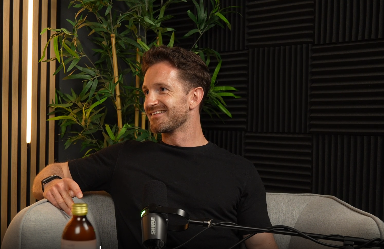 Jakob Blei smiling during a podcast conversation
